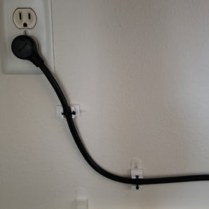 Commandstrip zip-tiehouder voor stroomkabel
