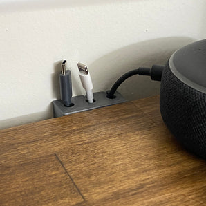 Flexibele kabelhouder voor bureau en muur