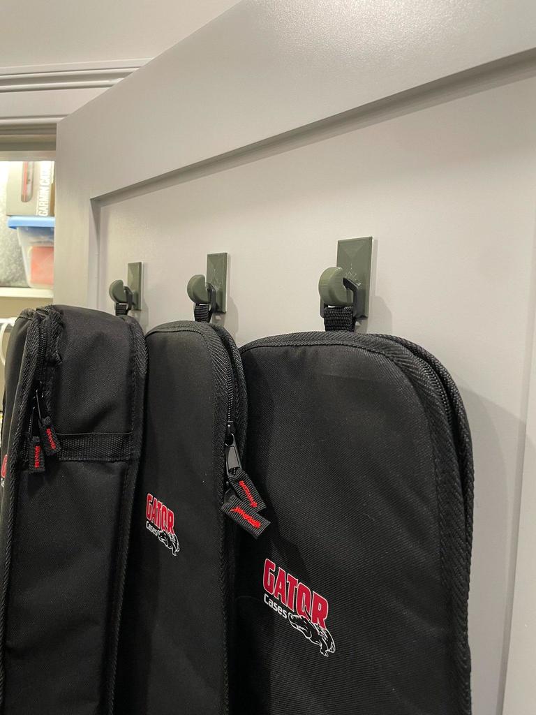 Parametrische muurhaak voor gitaartassen