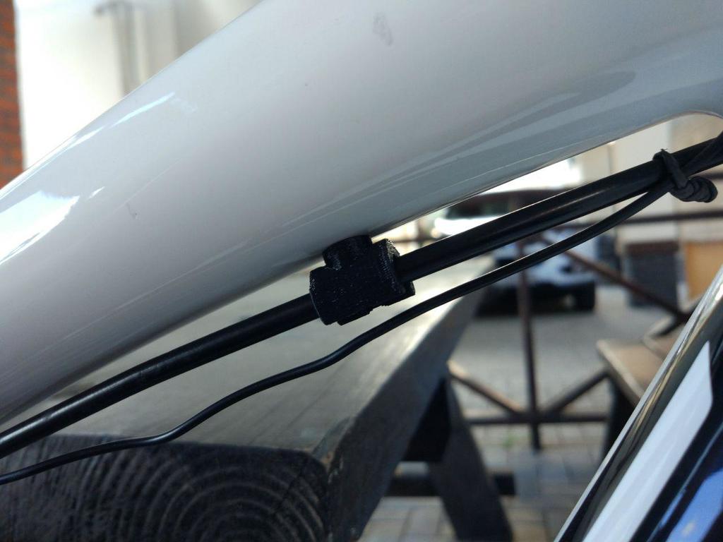 Remleidingklem en kabelhouder voor fiets