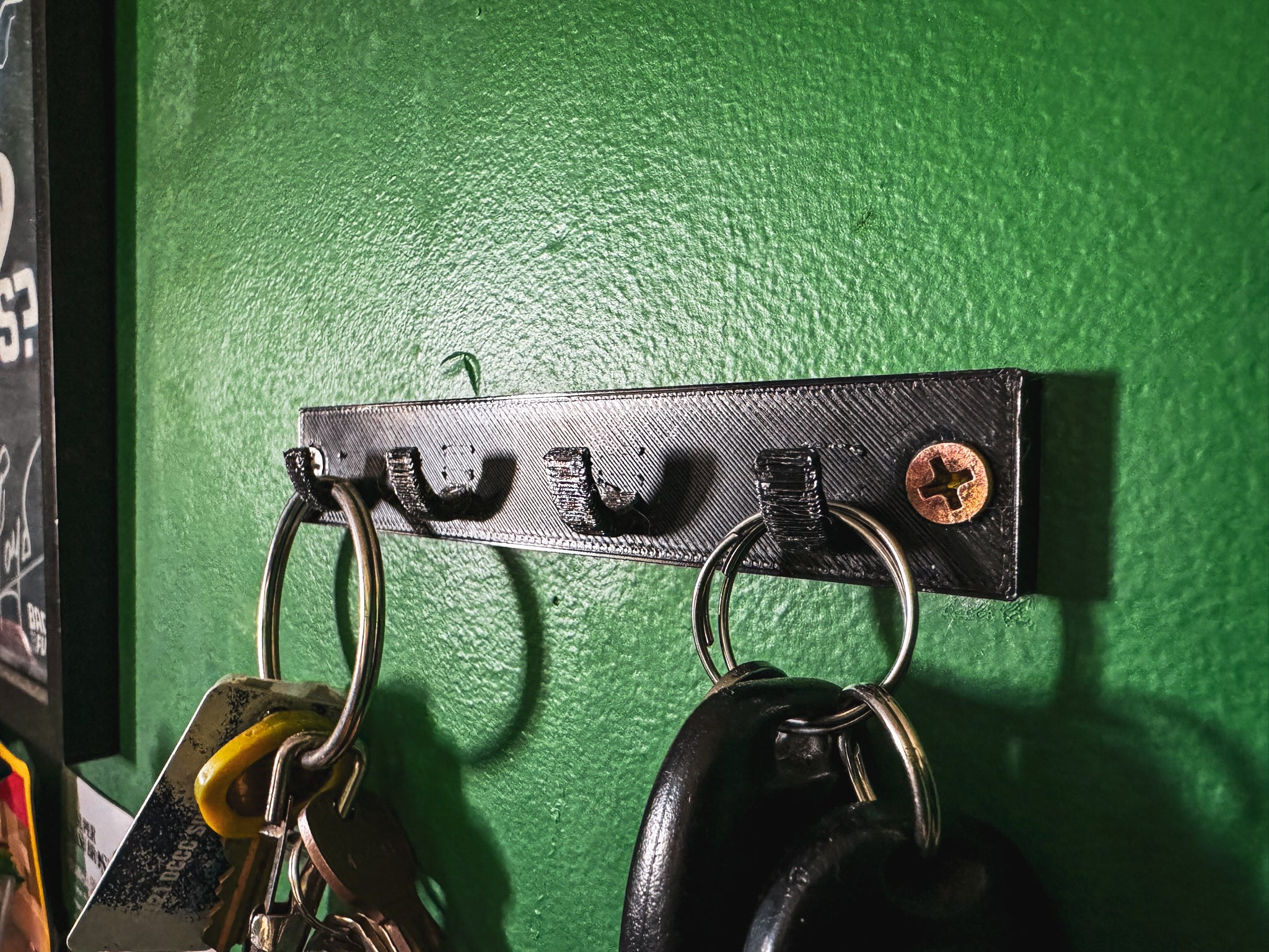 Wandgemonteerde sleutelhouder met 4 haken