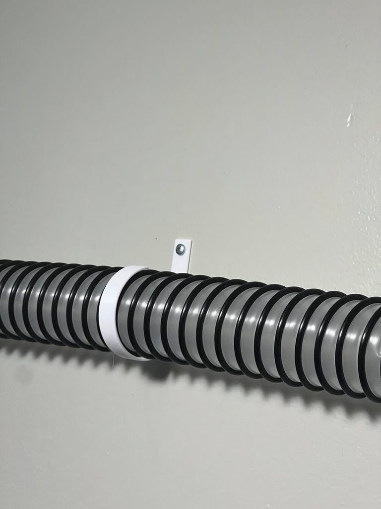 Wandgemonteerde houder voor 2-inch vacuümslang