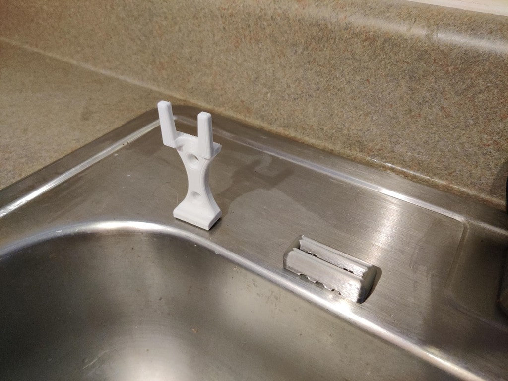 Afwasborstelhouder met zeepdispenser voor de gootsteen