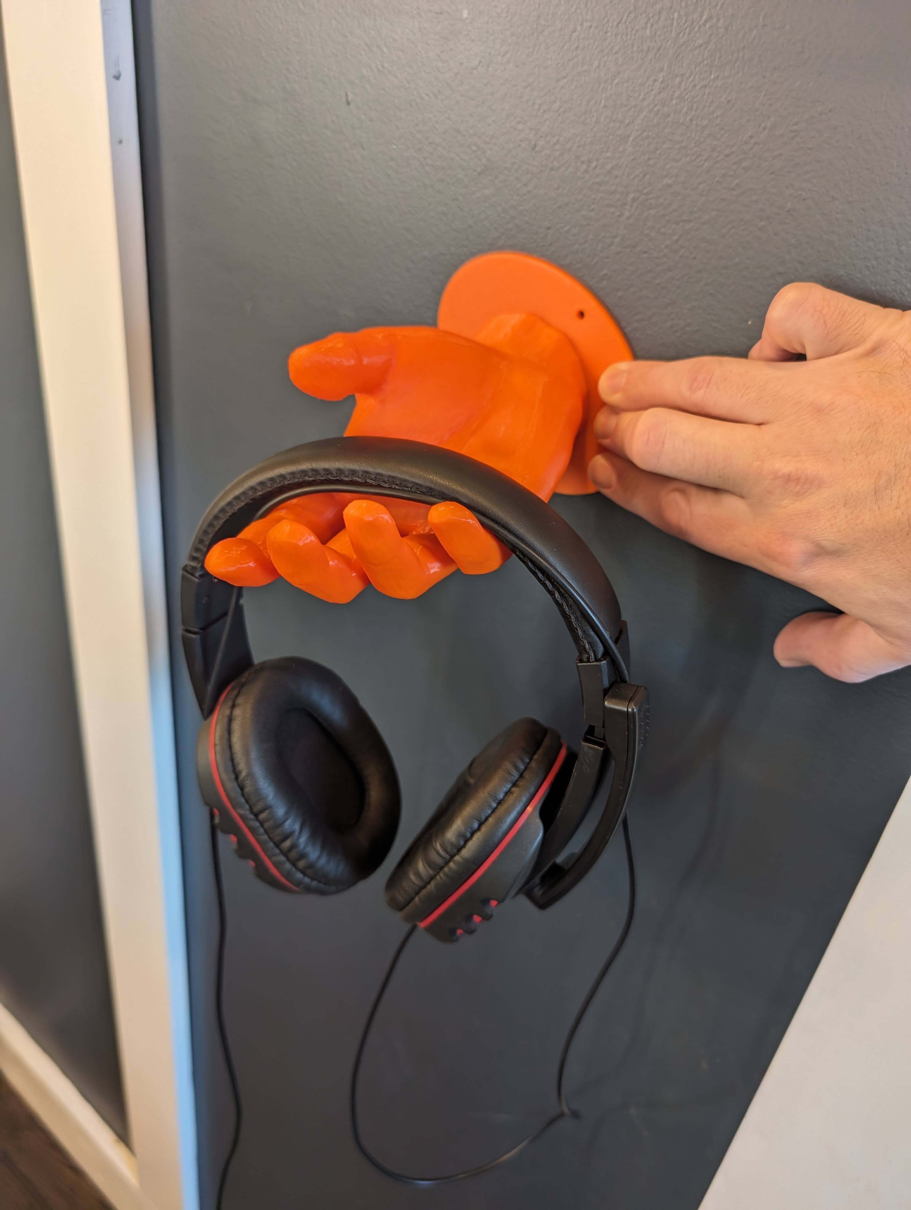 Wandmonteerbare hoofdtelefoonhouder in handvorm