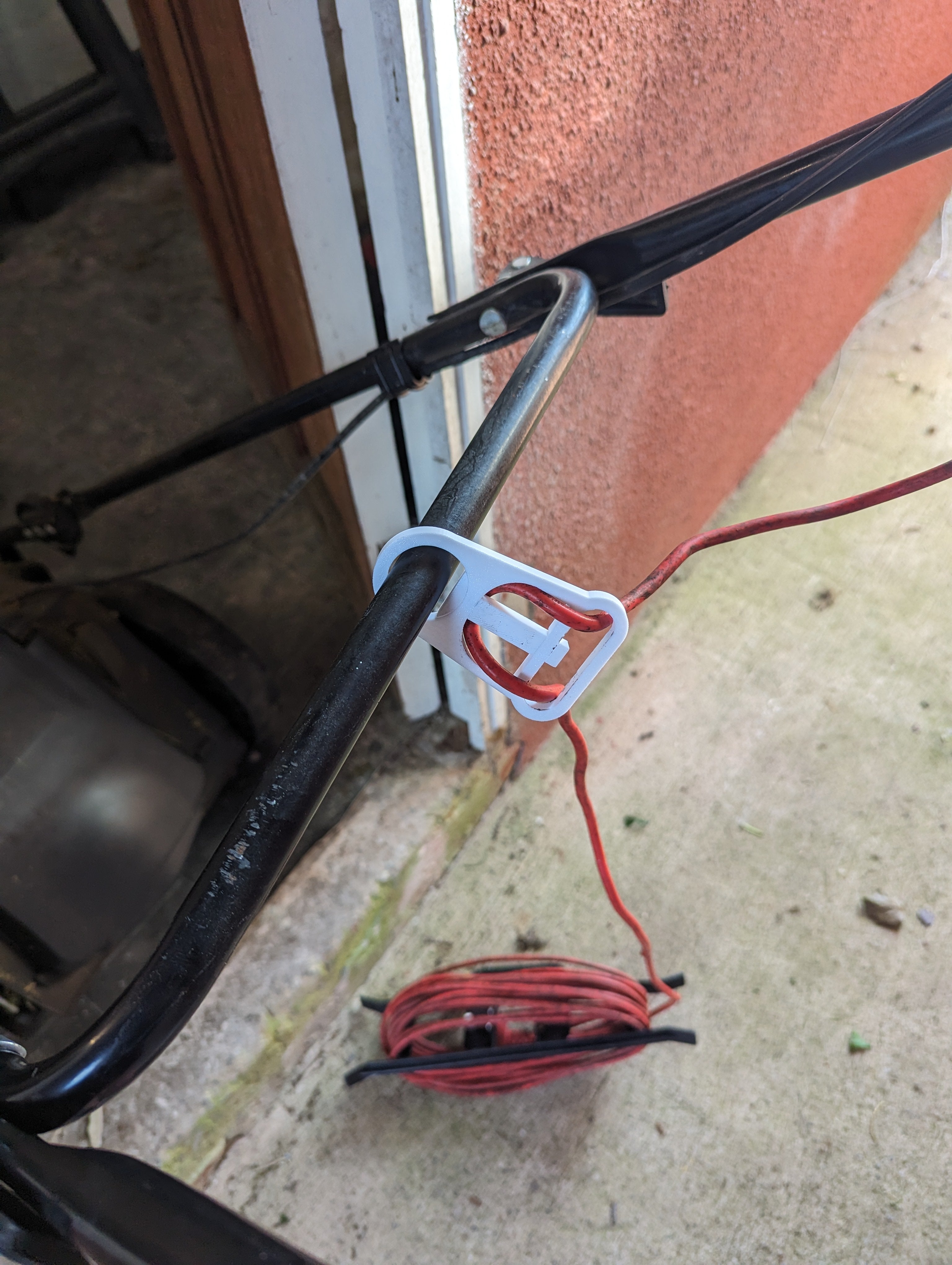 Kabelhouder voor elektrische grasmaaier