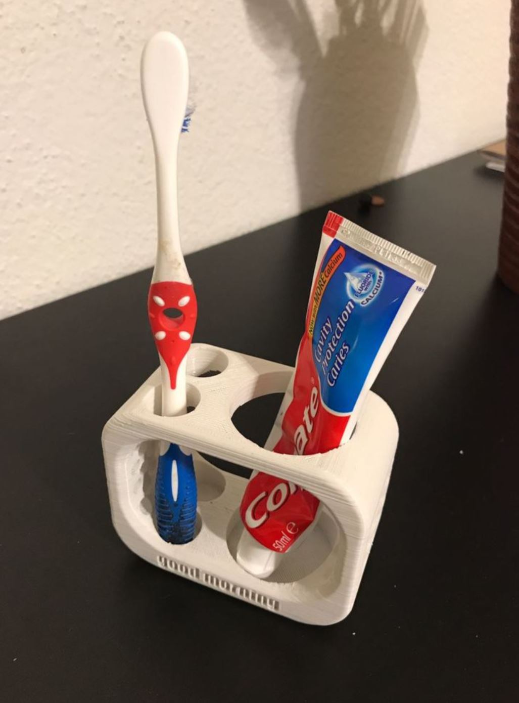 Tandenborstel- en tandpastahouder voor twee tandenborstels