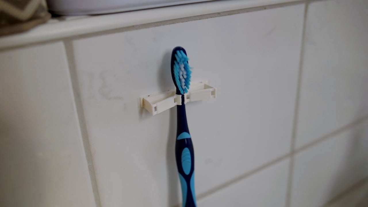 Compatibele tandenborstelhouder met flexibel mechanisme