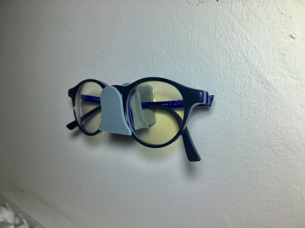 Wandmontage houder voor een bril